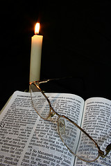 Open Bible with Candle